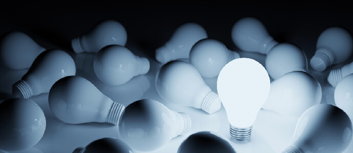 Light bulb bright outstanding among lightbulb on white background